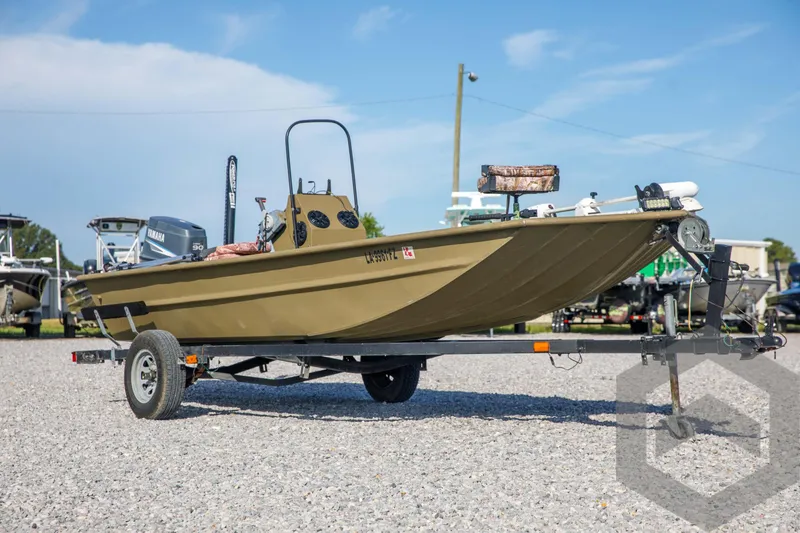Slide: The Image of 2003 Polar Kraft Sportsman MV1885CC boat on trailer in outdoor setting. - 3