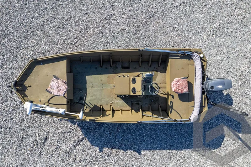 Slide: The Image of Aerial view of 2003 Polar Kraft Sportsman MV1885CC boat on gravel surface. - 41