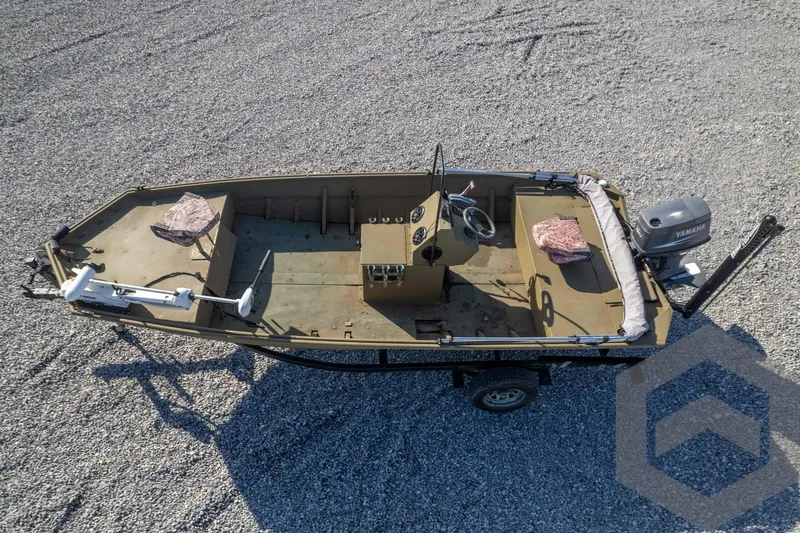 Slide: The Image of 2003 Polar Kraft Sportsman MV1885CC boat on gravel, aerial view. - 44