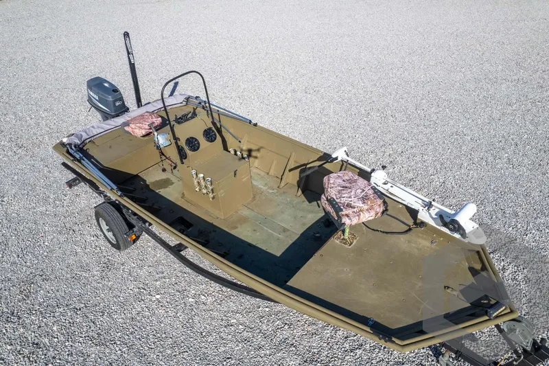 Slide: The Image of 2003 Polar Kraft Sportsman MV1885CC boat on trailer, gravel background. - 47