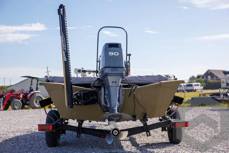 Slide: The Image of 2003 Polar Kraft Sportsman MV1885CC boat on trailer, rear view with outboard motor. - 5