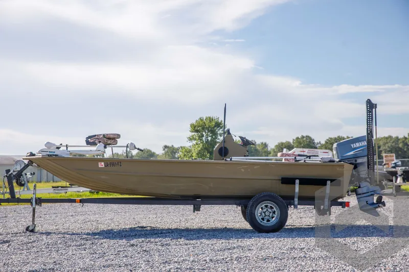 Slide: The Image of 2003 Polar Kraft Sportsman MV1885CC boat on trailer, parked outdoors. - 7