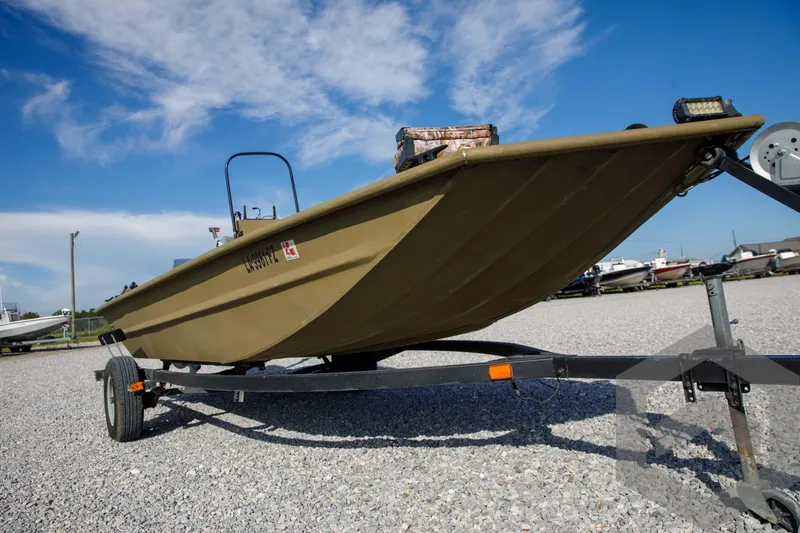 Slide: The Image of 2003 Polar Kraft Sportsman MV1885CC boat on trailer under blue sky. - 8