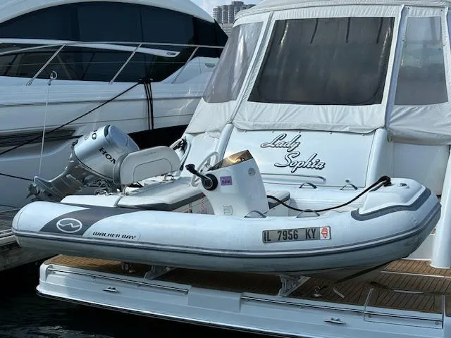 Slide: The Image of 2019 Walker Bay Generation 11 LTE inflatable boat docked on a yacht. - 6