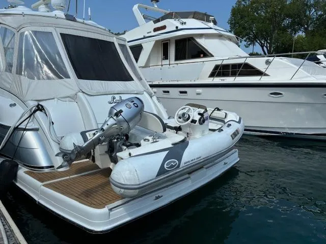 Slide: The Image of Walker Bay Generation 11 LTE 2019 inflatable boat docked beside a yacht. - 7