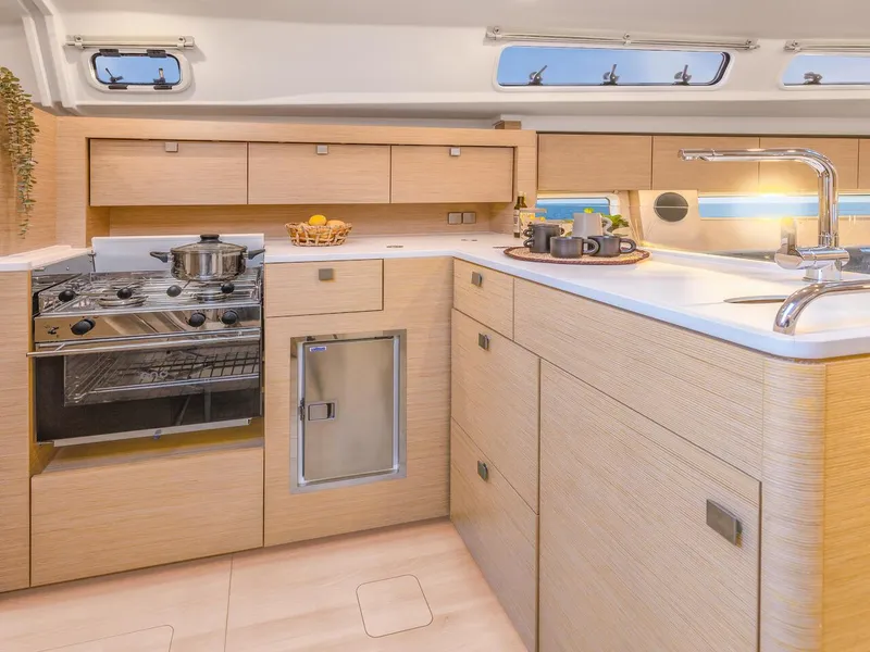 Slide: The Image of Modern kitchen interior of 2025 Hanse 410 yacht with sleek cabinetry and appliances. - 16