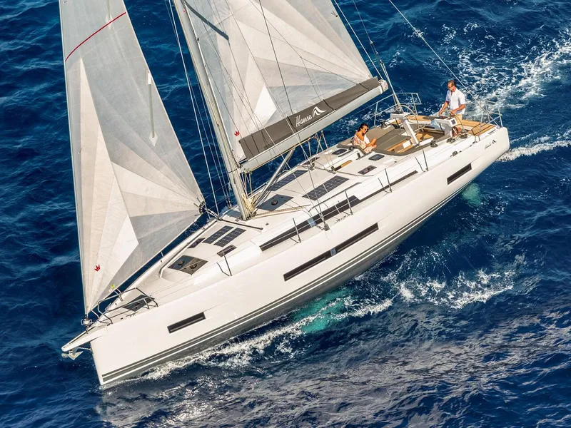 Slide: The Image of 2025 Hanse 410 yacht sailing on open blue sea. - 41