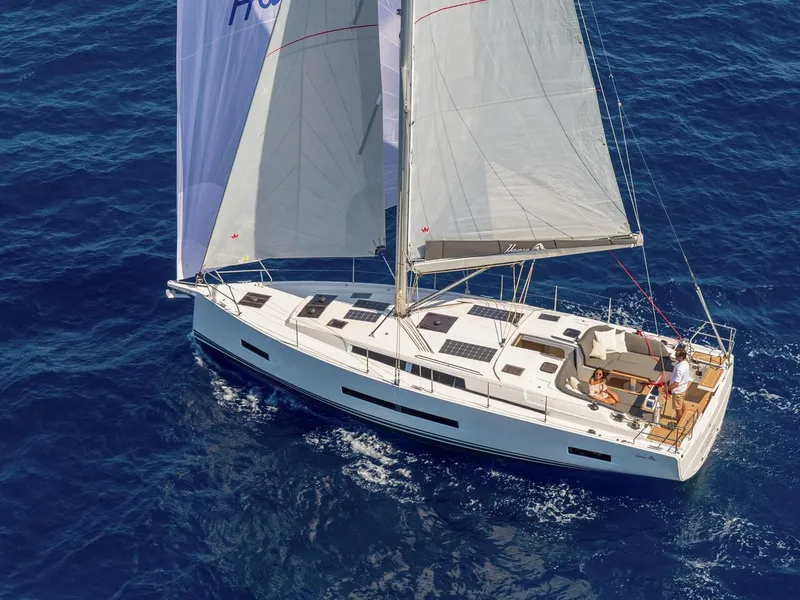 Slide: The Image of 2025 Hanse 410 sailboat cruising on open blue sea. - 47