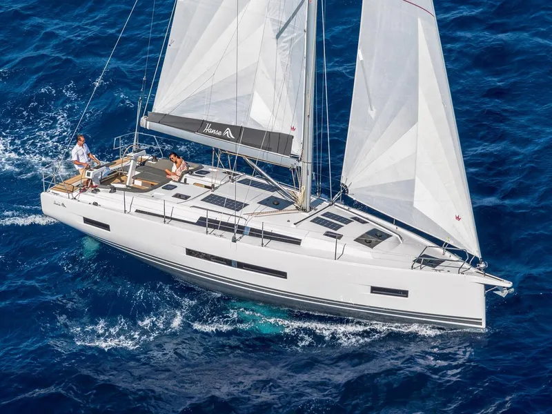 Slide: The Image of 2025 Hanse 410 yacht sailing on blue ocean waters. - 48