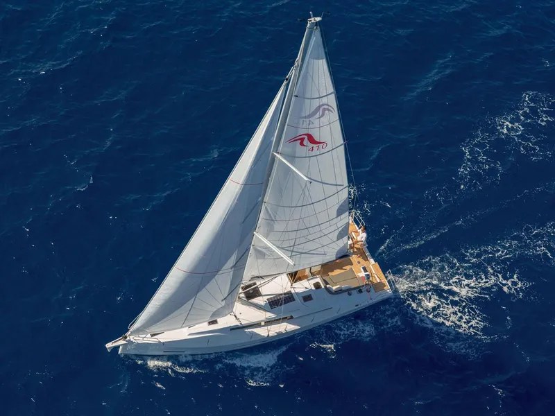 Slide: The Image of 2025 Hanse 410 sailboat navigating deep blue ocean waters. - 30
