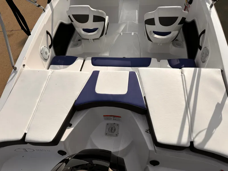 Slide: The Image of 2024 Tahoe 185 S boat interior with white and blue seating. - 3