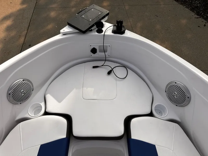 Slide: The Image of 2024 Tahoe 185 S boat interior with speakers and seating area. - 7