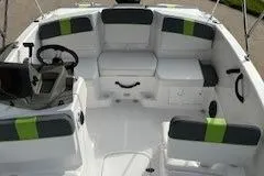 Slide: The Image of 2024 Tahoe T16 boat interior with modern seating and steering console. - 4