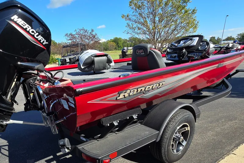 Slide: The Image of 2024 Ranger RT188 boat with Mercury engine, red exterior, parked on trailer. - 4