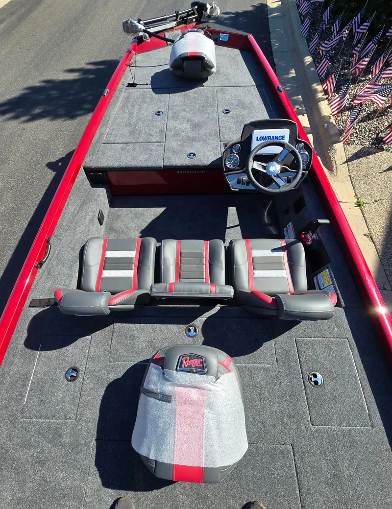 Slide: The Image of 2024 Ranger RT188 fishing boat with red trim and spacious seating. - 5
