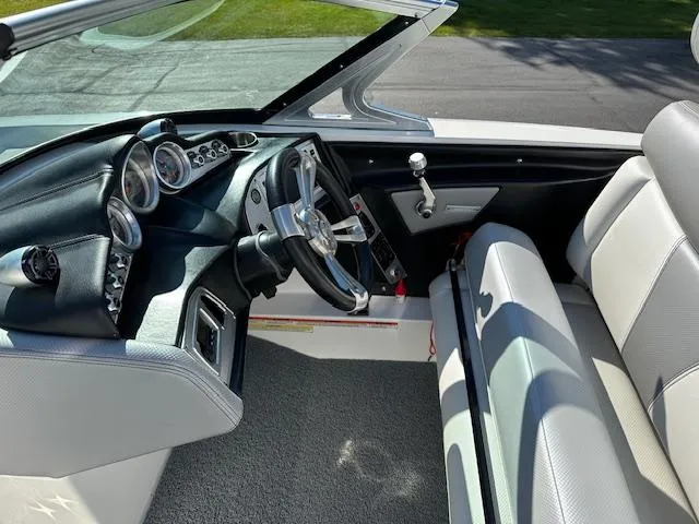 Slide: The Image of 2016 MasterCraft X46 boat interior with steering wheel and dashboard. - 11