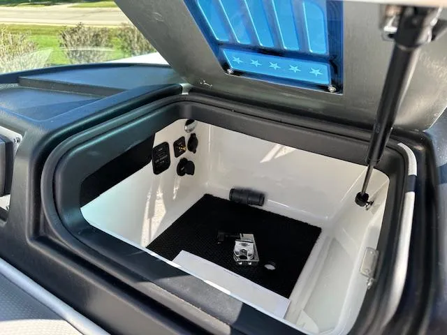 Slide: The Image of Open storage compartment in 2016 MasterCraft X46 boat. - 16