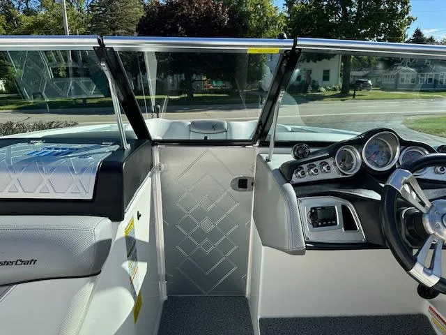 Slide: The Image of 2016 MasterCraft X46 boat interior with modern dashboard and steering wheel. - 17