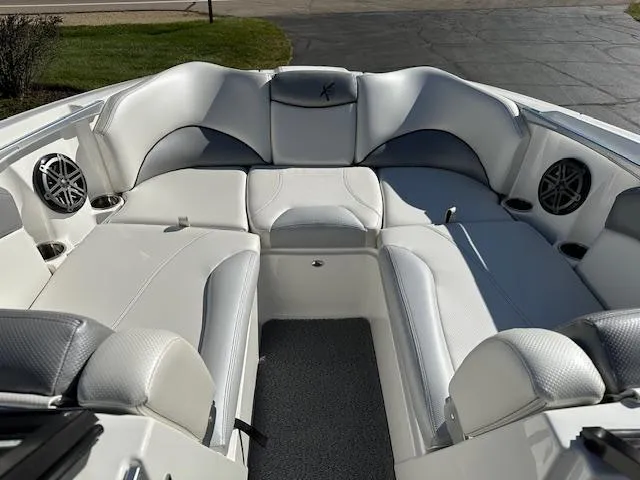 Slide: The Image of 2016 MasterCraft X46 boat interior with white seating and built-in speakers. - 19
