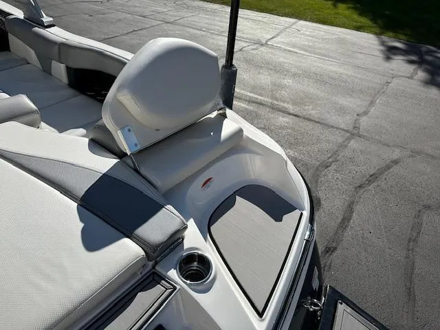Slide: The Image of 2016 MasterCraft X46 boat interior with cushioned seating and cup holder. - 34