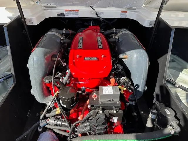 Slide: The Image of 2016 MasterCraft X46 engine compartment with Ilmor engine, showcasing detailed components. - 35