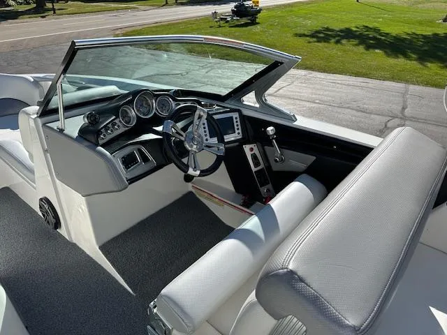 Slide: The Image of 2016 MasterCraft X46 boat interior with steering wheel and dashboard controls. - 7