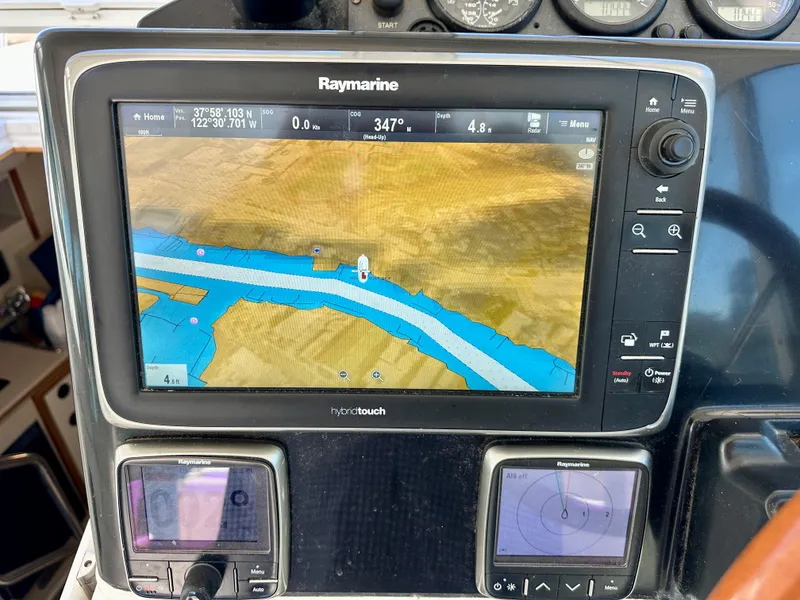 Slide: The Image of Raymarine navigation system on 2005 Albin Tournament Express boat dashboard. - 15