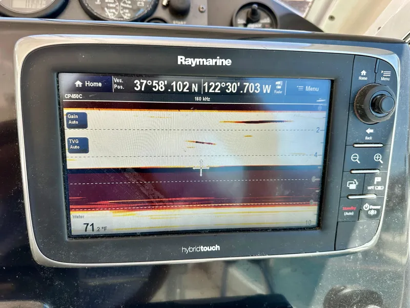 Slide: The Image of Raymarine display on 2005 Albin Tournament Express showing GPS coordinates and sonar data. - 16