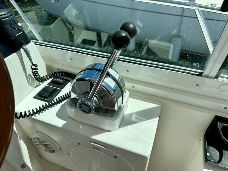 Slide: The Image of Throttle controls on a 2005 Albin Tournament Express boat cockpit. - 18