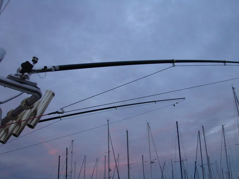 Slide: The Image of Fishing rods on a 2005 Albin Tournament Express boat at sunset. - 23