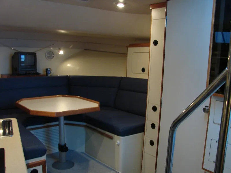 Slide: The Image of 2005 Albin Tournament Express interior with cozy seating and table. - 31