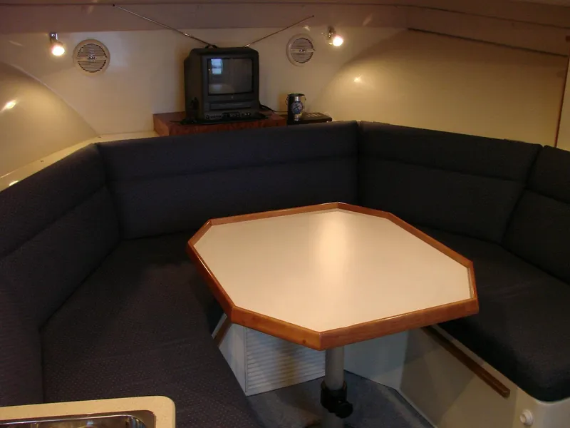 Slide: The Image of 2005 Albin Tournament Express interior with octagonal table and cozy seating area. - 33