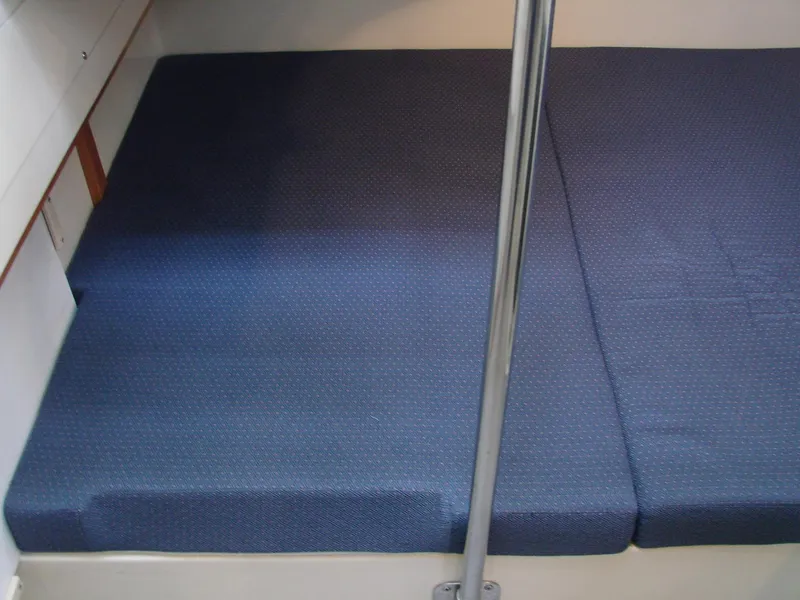 Slide: The Image of 2005 Albin Tournament Express interior with blue cushions and metal support pole. - 37