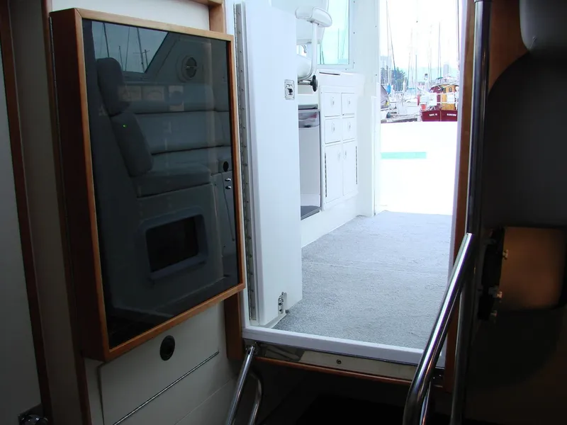 Slide: The Image of Interior view of 2005 Albin Tournament Express boat, showing cabin entrance and seating area. - 38