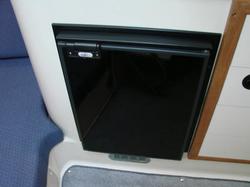 Slide: The Image of 2005 Albin Tournament Express interior with compact black refrigerator. - 41