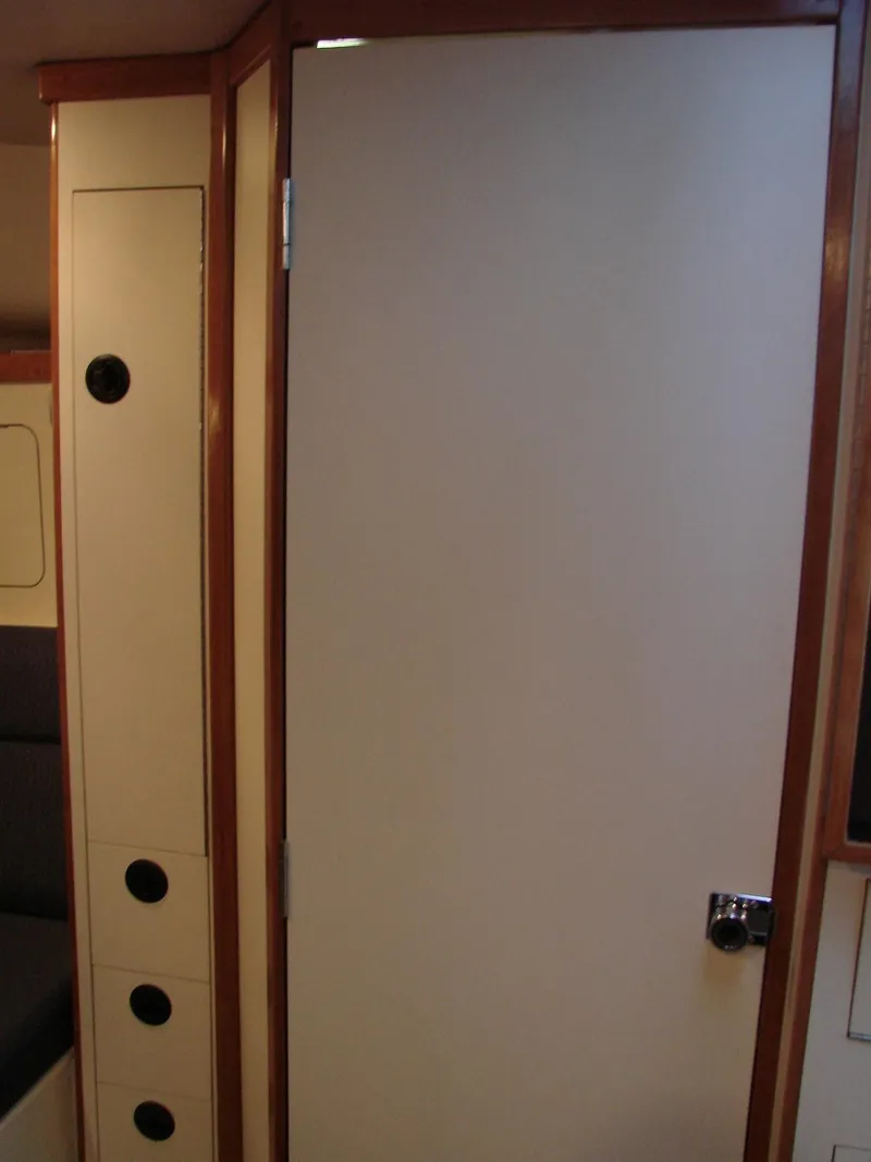 Slide: The Image of 2005 Albin Tournament Express interior cabin door with wood trim. - 44
