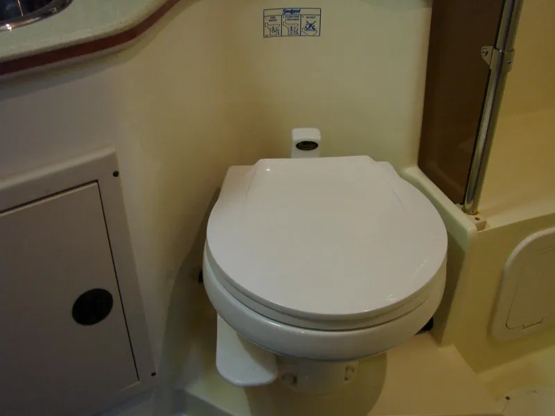 Slide: The Image of 2005 Albin Tournament Express boat bathroom with toilet. - 47