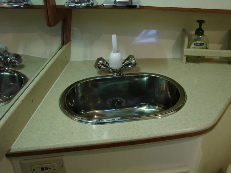 Slide: The Image of 2005 Albin Tournament Express bathroom sink with mirror and soap dispenser. - 48
