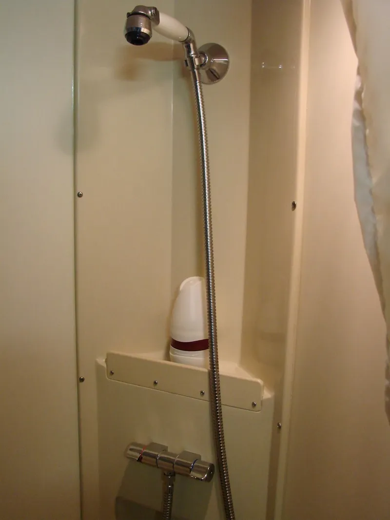 Slide: The Image of 2005 Albin Tournament Express shower area with handheld showerhead and soap holder. - 49