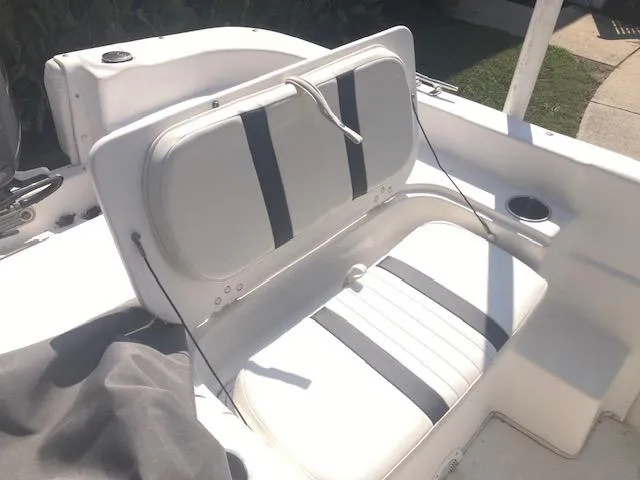 Slide: The Image of 2011 Carolina Skiff 258 DLV boat seat with white and black upholstery. - 14