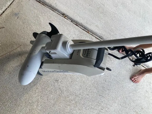 Slide: The Image of MotorGuide trolling motor on concrete, associated with 2011 Carolina Skiff 258 DLV. - 16