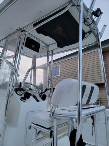 Slide: The Image of 2011 Carolina Skiff 258 DLV boat interior with steering console and seating. - 4