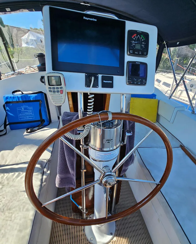 Slide: The Image of Steering wheel and navigation equipment on a 2005 Nonsuch 33 sailboat. - 12