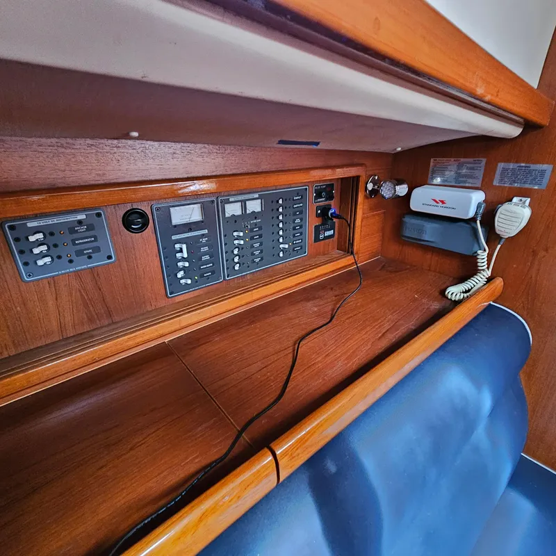 Slide: The Image of Control panel and communication equipment inside a 2005 Nonsuch 33 sailboat cabin. - 22