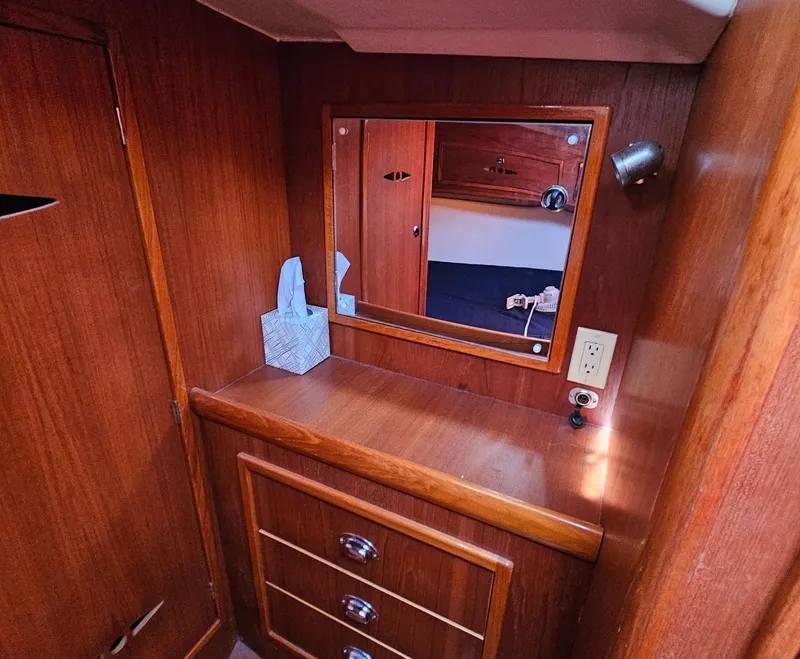 Slide: The Image of Wooden interior of a 2005 Nonsuch 33 boat with mirror and drawers. - 26