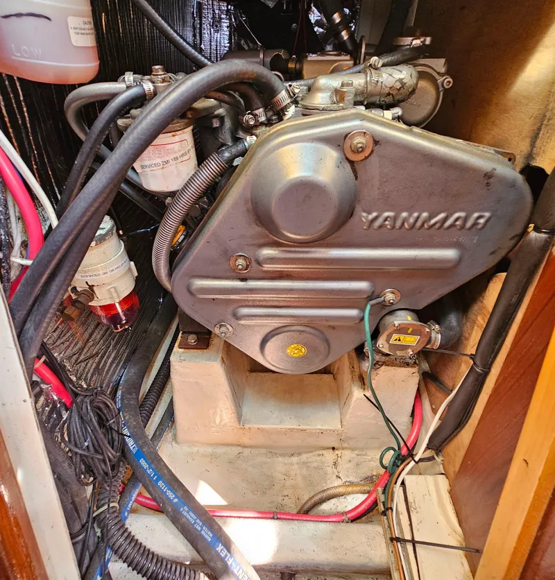 Slide: The Image of Yanmar engine in a 2005 Nonsuch 33 sailboat, showing detailed components and wiring. - 31