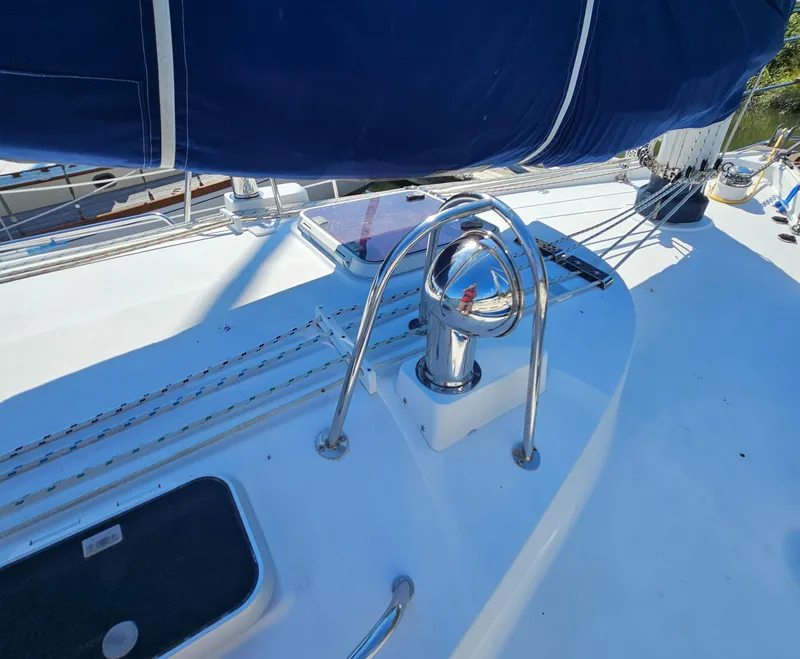 Slide: The Image of Nonsuch 33 sailboat deck with winch and blue sail cover, 2005 model. - 7