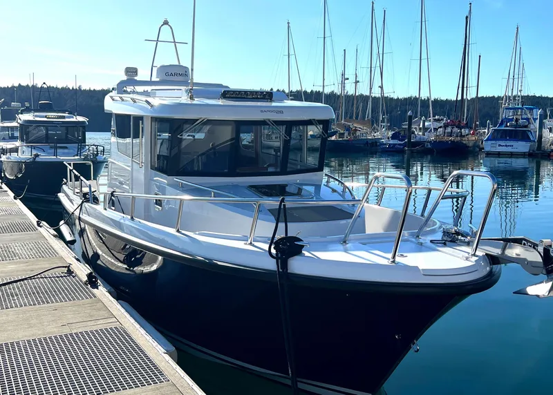 The Image of 2023 Sargo 28 boat docked in a marina with clear blue skies. - 0