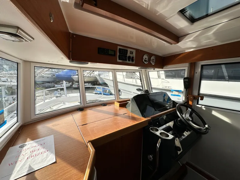 Slide: The Image of Interior of 2023 Sargo 28 boat with steering wheel and dashboard. - 12