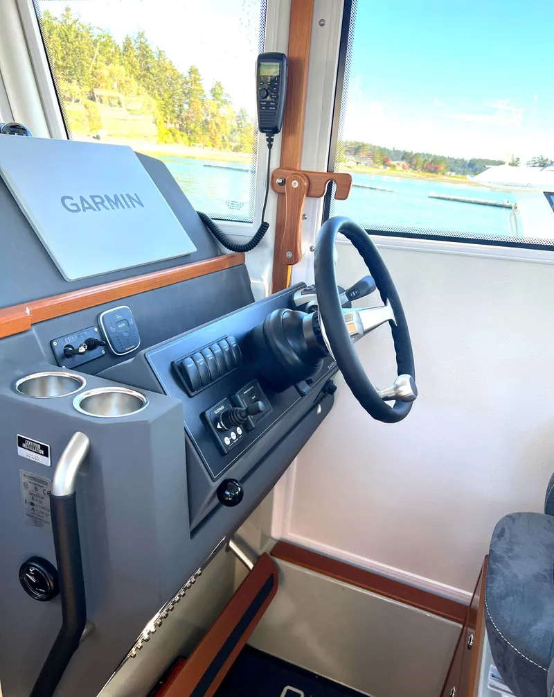 Slide: The Image of Interior helm of 2023 Sargo 28 boat with Garmin navigation system. - 14